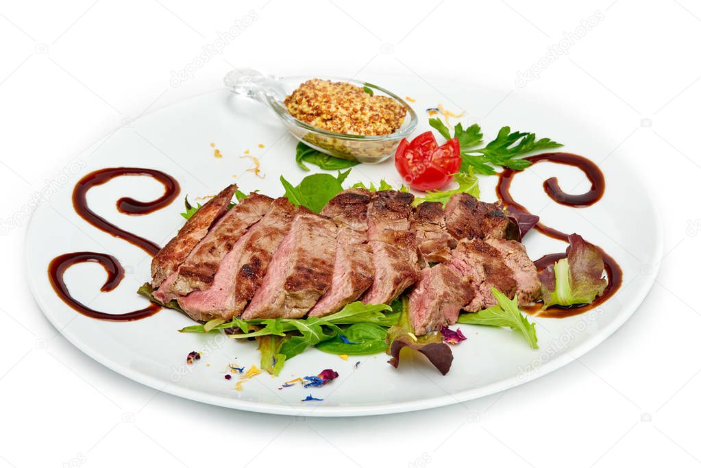 Italian food, Sirloin steak of beef with ancient mustard served on white plate, isolated on white background