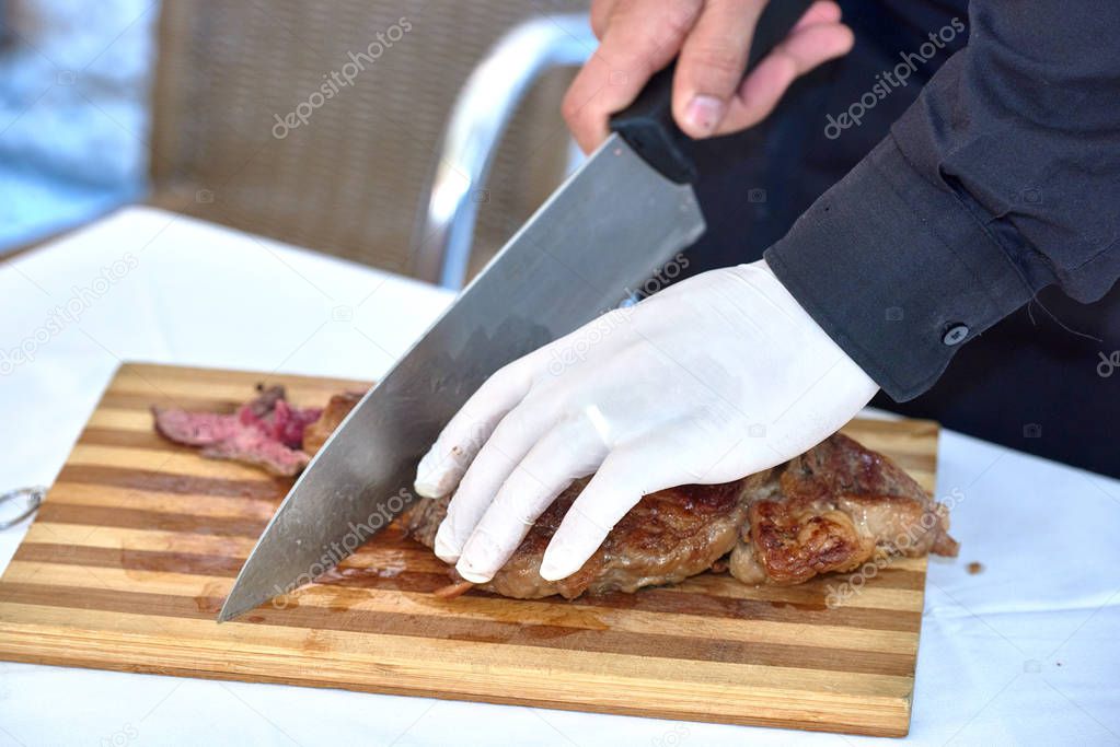man preparing ribs close up