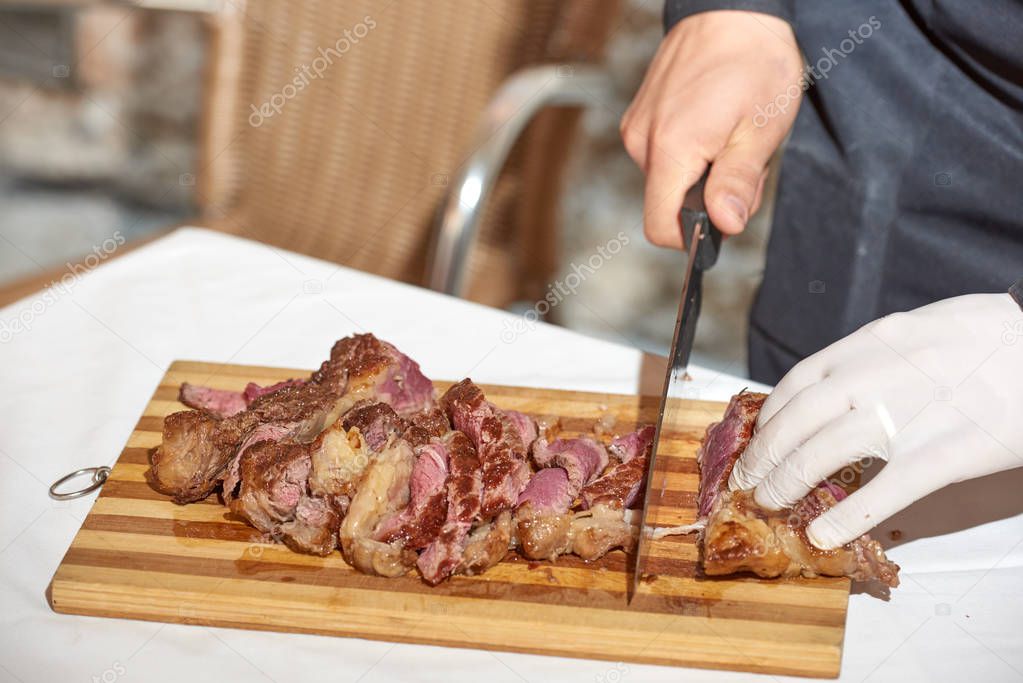 man preparing ribs close up