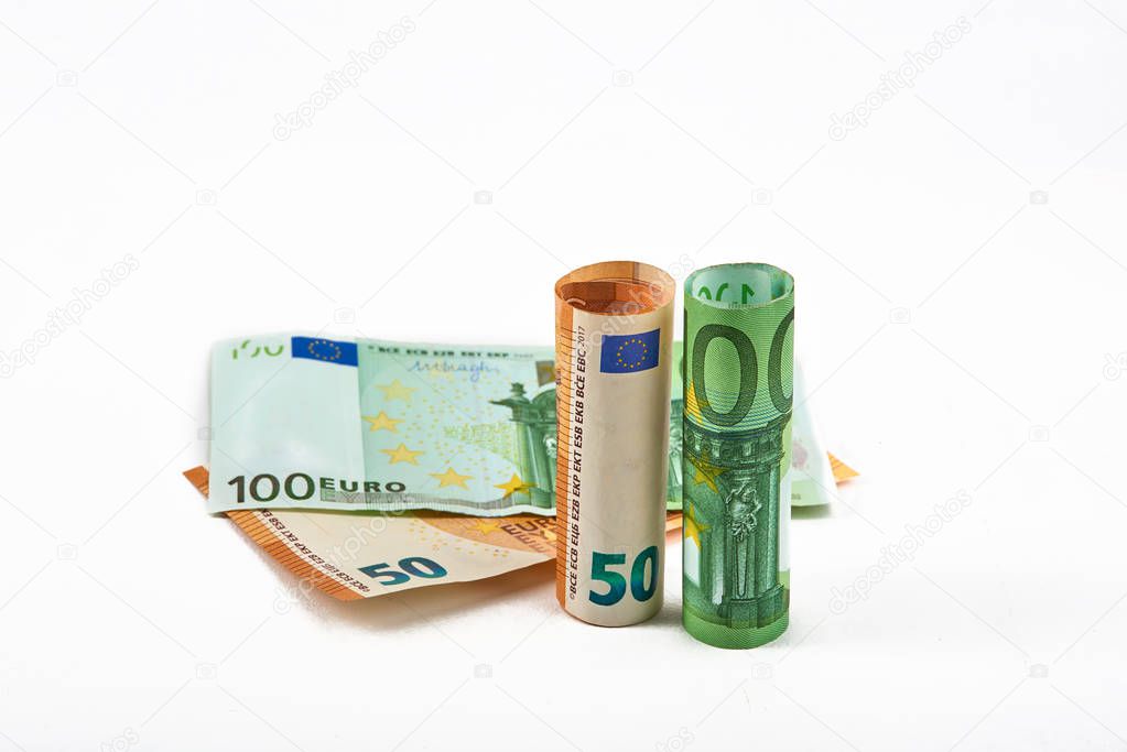 Euro money bank. Rolled up Euro bills on white background. One hundred and 50 Euro bills