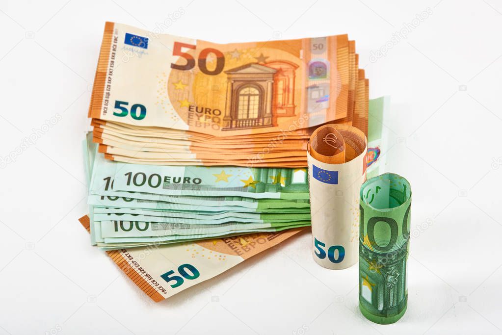 Euro money bank. Rolled up Euro bills on white background. One hundred and 50 Euro bills