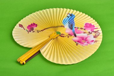 Geleneksel Çince portre fan yeşil zemin üzerine kağıt. El kağıt fan