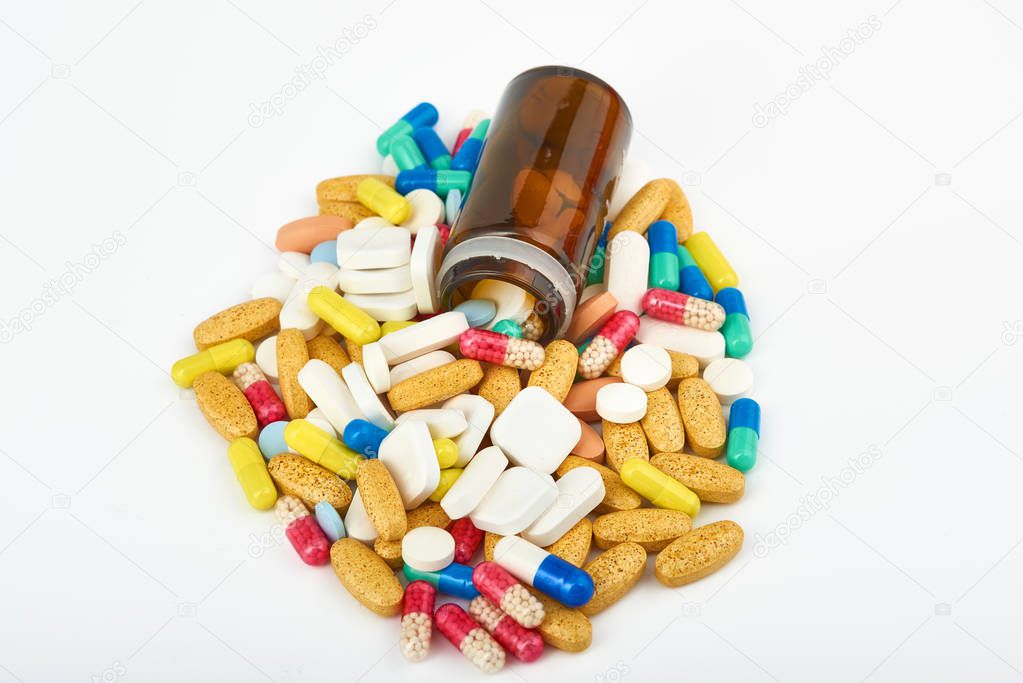 Medicine Pills. Tablets. Capsule.Pharmaceutical medicament, Close-up of pile of blue,white,yellow and green tablets - capsule. Pills and tablets on white background,Assorted pharmaceutical medicine