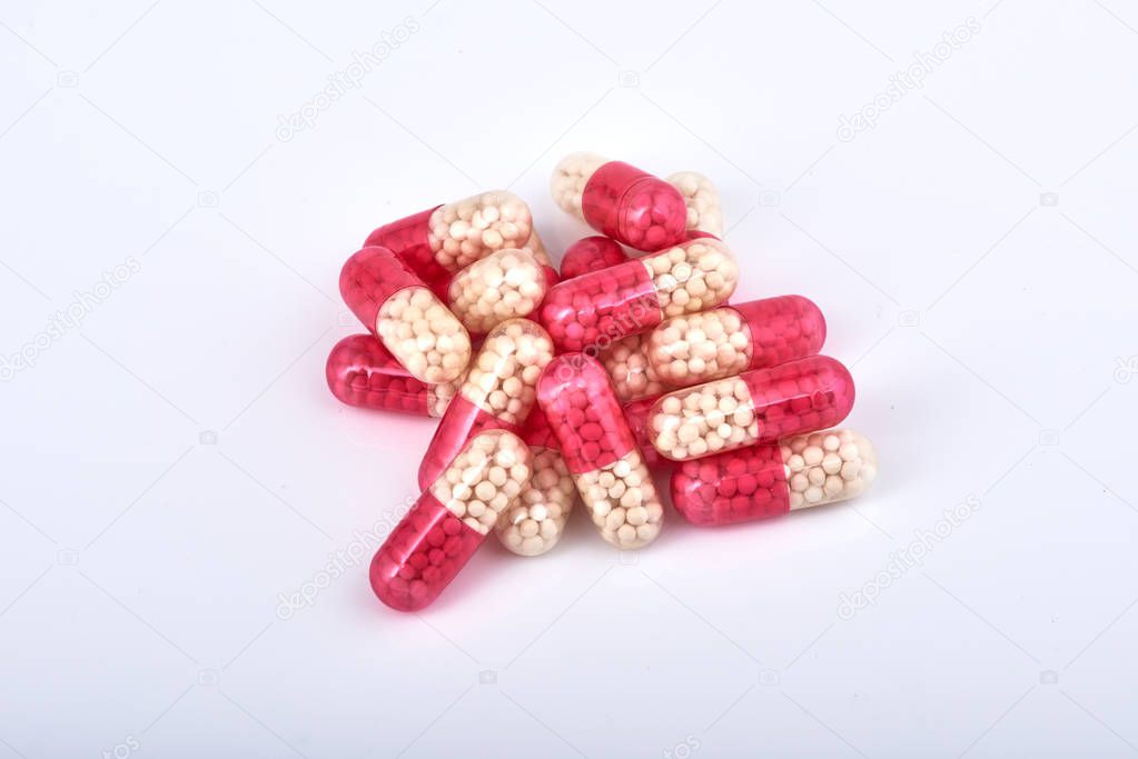 Medicine Pills. Tablets. Capsule.Pharmaceutical medicament, Close-up of pile of RED tablets - capsule. Pills and tablets on white background,Assorted pharmaceutical