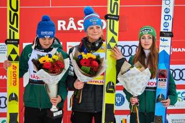 Merkezine, Romanya - 25-27 Ocak 2019:Carina Vogt (2), Maren Lundby (1) ve Juliane Seyfarth podyum sonra bayanlar FIS Dünya Kupası Kayak atlama merkezine (3) poz