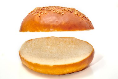 Burger bun cut in two isolated on white background clipart