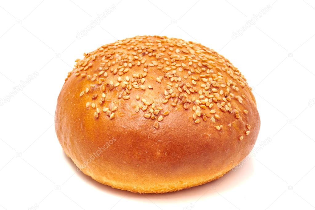 Hamburger bun with sesame seeds isolated on white background