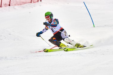 BRASOV, ROMANIA -13 February 2018: Young competitors in Romania Teleferic CUP Junior alpine Ski 2 edition in Poiana Brasov, Romania