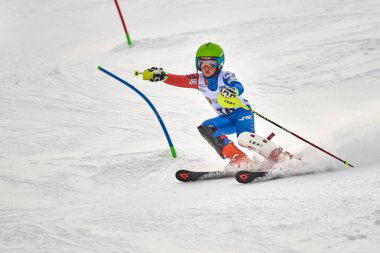 BRASOV, ROMANIA -13 February 2018: Young competitors in Romania Teleferic CUP Junior alpine Ski 2 edition in Poiana Brasov, Romania
