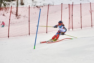 BRASOV, ROMANIA -13 February 2018: Young competitors in Romania Teleferic CUP Junior alpine Ski 2 edition in Poiana Brasov, Romania