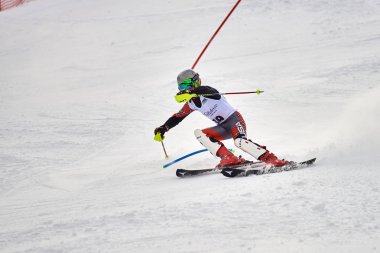 BRASOV, ROMANIA -13 February 2018: Young competitors in Romania Teleferic CUP Junior alpine Ski 2 edition in Poiana Brasov, Romania