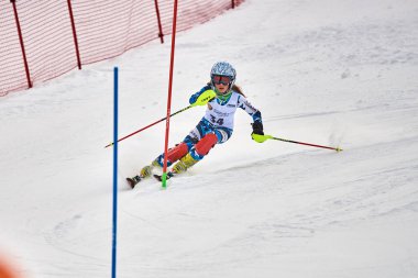 BRASOV, ROMANIA -13 February 2018: Young competitors in Romania Teleferic CUP Junior alpine Ski 2 edition in Poiana Brasov, Romania