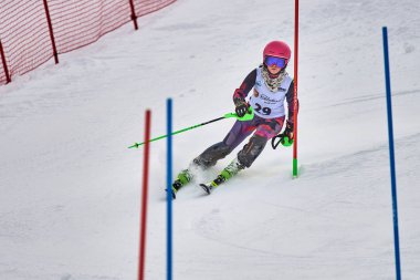 BRASOV, ROMANIA -13 February 2018: Young competitors in Romania Teleferic CUP Junior alpine Ski 2 edition in Poiana Brasov, Romania