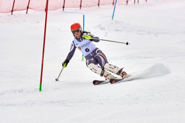 BRASOV, ROMANIA -13 February 2018: Young competitors in Romania Teleferic CUP Junior alpine Ski 2 edition in Poiana Brasov, Romania