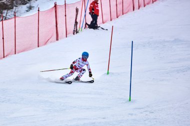 BRASOV, ROMANIA -13 February 2018: Young competitors in Romania Teleferic CUP Junior alpine Ski 2 edition in Poiana Brasov, Romania