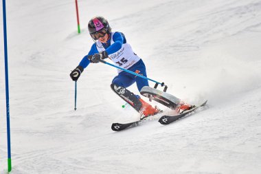 BRASOV, ROMANIA -13 February 2018: Young competitors in Romania Teleferic CUP Junior alpine Ski 2 edition in Poiana Brasov, Romania