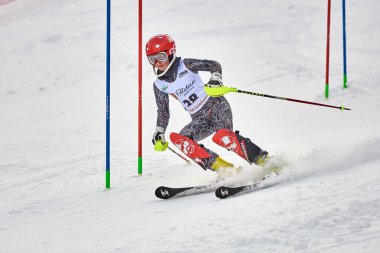 BRASOV, ROMANIA -13 February 2018: Young competitors in Romania Teleferic CUP Junior alpine Ski 2 edition in Poiana Brasov, Romania
