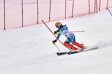 BRASOV, ROMANIA -13 February 2018: Young competitors in Romania Teleferic CUP Junior alpine Ski 2 edition in Poiana Brasov, Romania