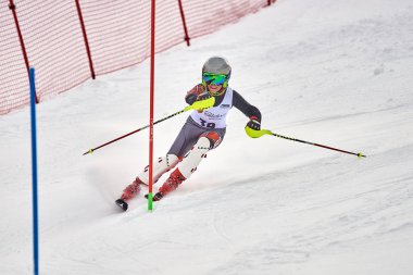BRASOV, ROMANIA -13 February 2018: Young competitors in Romania Teleferic CUP Junior alpine Ski 2 edition in Poiana Brasov, Romania