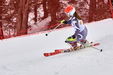 BRASOV, ROMANIA -13 February 2018: Young competitors in Romania Teleferic CUP Junior alpine Ski 2 edition in Poiana Brasov, Romania