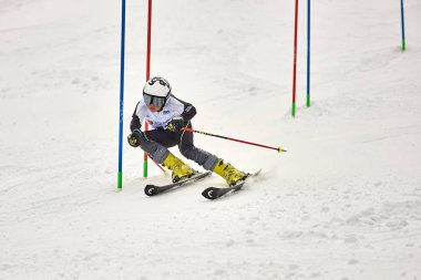 BRASOV, ROMANIA -13 February 2018: Young competitors in Romania Teleferic CUP Junior alpine Ski 2 edition in Poiana Brasov, Romania