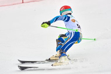 BRASOV, ROMANIA -13 February 2018: Young competitors in Romania Teleferic CUP Junior alpine Ski 2 edition in Poiana Brasov, Romania