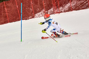 BRASOV, ROMANIA -13 February 2018: Young competitors in Romania Teleferic CUP Junior alpine Ski 2 edition in Poiana Brasov, Romania