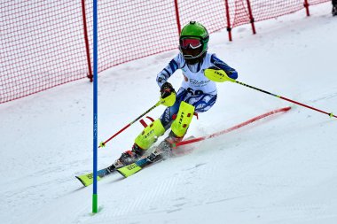 BRASOV, ROMANIA -13 February 2018: Young competitors in Romania Teleferic CUP Junior alpine Ski 2 edition in Poiana Brasov, Romania