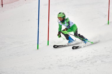 BRASOV, ROMANIA -13 February 2018: Young competitors in Romania Teleferic CUP Junior alpine Ski 2 edition in Poiana Brasov, Romania