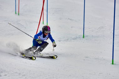 BRASOV, ROMANIA -13 February 2018: Young competitors in Romania Teleferic CUP Junior alpine Ski 2 edition in Poiana Brasov, Romania