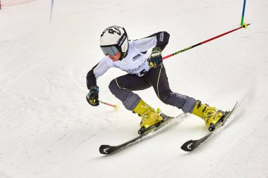 BRASOV, ROMANIA -13 February 2018: Young competitors in Romania Teleferic CUP Junior alpine Ski 2 edition in Poiana Brasov, Romania