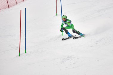 BRASOV, ROMANIA -13 February 2018: Young competitors in Romania Teleferic CUP Junior alpine Ski 2 edition in Poiana Brasov, Romania