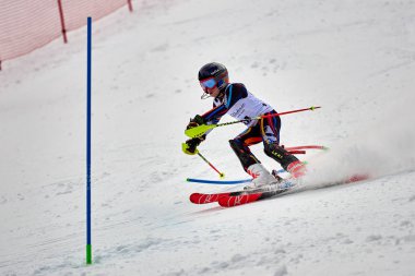BRASOV, ROMANIA -13 February 2018: Young competitors in Romania Teleferic CUP Junior alpine Ski 2 edition in Poiana Brasov, Romania
