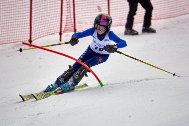 BRASOV, ROMANIA -13 February 2018: Young competitors in Romania Teleferic CUP Junior alpine Ski 2 edition in Poiana Brasov, Romania