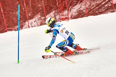 BRASOV, ROMANIA -13 February 2018: Young competitors in Romania Teleferic CUP Junior alpine Ski 2 edition in Poiana Brasov, Romania