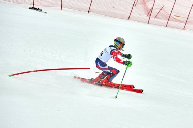 BRASOV, ROMANIA -13 February 2018: Young competitors in Romania Teleferic CUP Junior alpine Ski 2 edition in Poiana Brasov, Romania