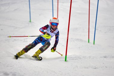 BRASOV, ROMANIA -13 February 2018: Young competitors in Romania Teleferic CUP Junior alpine Ski 2 edition in Poiana Brasov, Romania