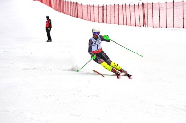 BRASOV, ROMANIA -13 February 2018: Young competitors in Romania Teleferic CUP Junior alpine Ski 2 edition in Poiana Brasov, Romania