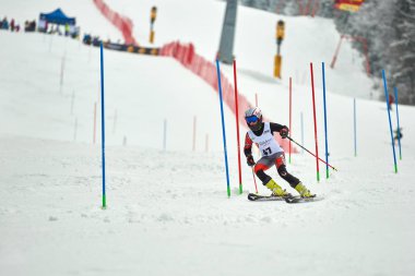 BRASOV, ROMANIA -13 February 2018: Young competitors in Romania Teleferic CUP Junior alpine Ski 2 edition in Poiana Brasov, Romania