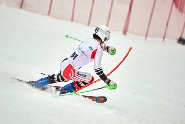 BRASOV, ROMANIA -13 February 2018: Young competitors in Romania Teleferic CUP Junior alpine Ski 2 edition in Poiana Brasov, Romania