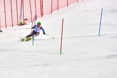 BRASOV, ROMANIA -13 February 2018: Young competitors in Romania Teleferic CUP Junior alpine Ski 2 edition in Poiana Brasov, Romania