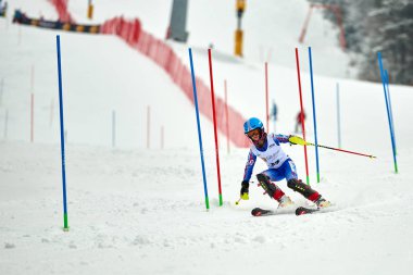BRASOV, ROMANIA -13 February 2018: Young competitors in Romania Teleferic CUP Junior alpine Ski 2 edition in Poiana Brasov, Romania