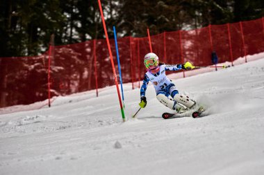 BRASOV, ROMANIA -13 February 2018: Young competitors in Romania Teleferic CUP Junior alpine Ski 2 edition in Poiana Brasov, Romania