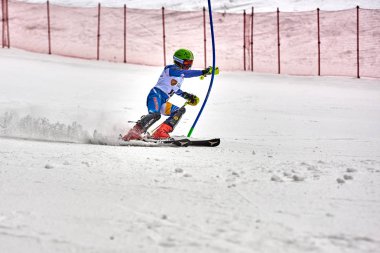 BRASOV, ROMANIA -13 February 2018: Young competitors in Romania Teleferic CUP Junior alpine Ski 2 edition in Poiana Brasov, Romania