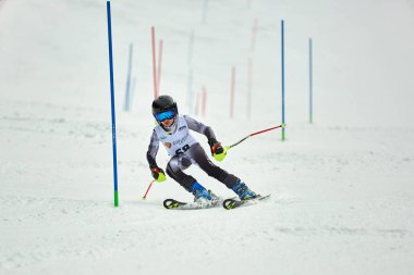 BRASOV, ROMANIA -13 February 2018: Young competitors in Romania Teleferic CUP Junior alpine Ski 2 edition in Poiana Brasov, Romania