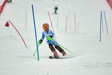 BRASOV, ROMANIA -13 February 2018: Young competitors in Romania Teleferic CUP Junior alpine Ski 2 edition in Poiana Brasov, Romania
