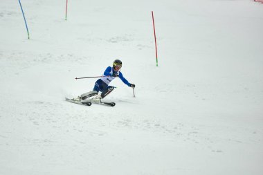 BRASOV, ROMANIA -13 February 2018: Young competitors in Romania Teleferic CUP Junior alpine Ski 2 edition in Poiana Brasov, Romania