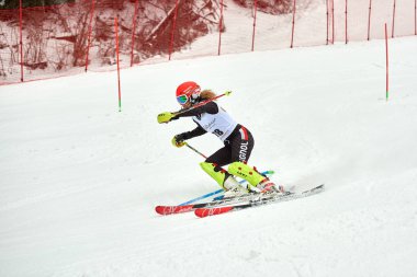 BRASOV, ROMANIA -13 February 2018: Young competitors in Romania Teleferic CUP Junior alpine Ski 2 edition in Poiana Brasov, Romania