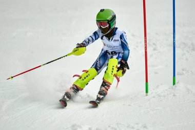 BRASOV, ROMANIA -13 February 2018: Young competitors in Romania Teleferic CUP Junior alpine Ski 2 edition in Poiana Brasov, Romania