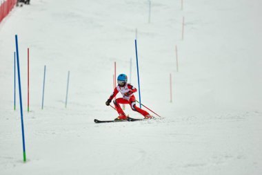 BRASOV, ROMANIA -13 February 2018: Young competitors in Romania Teleferic CUP Junior alpine Ski 2 edition in Poiana Brasov, Romania